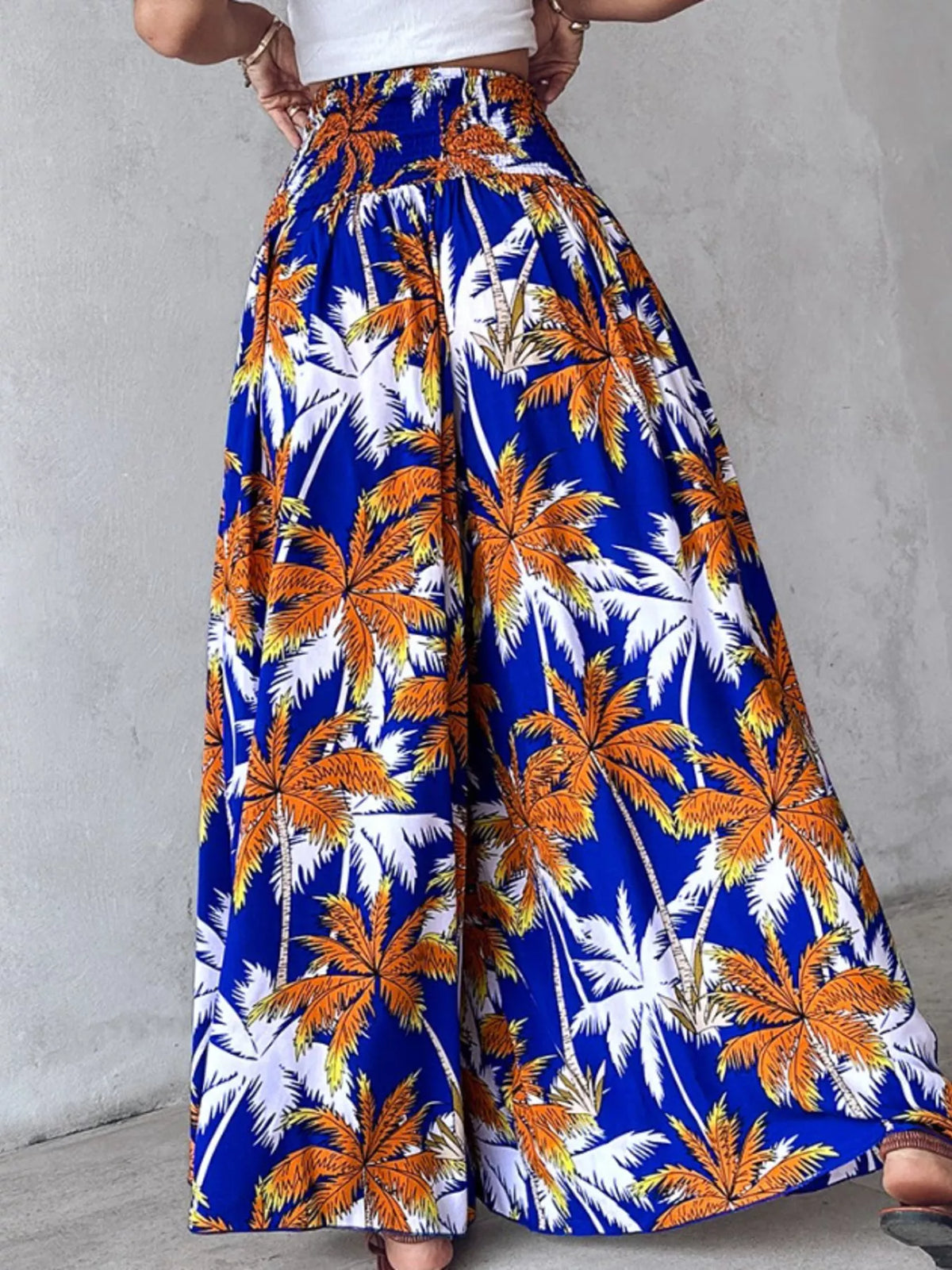 Printed wide-leg pants by Plush Fashion Hub featuring a colorful pattern and relaxed fit for casual or stylish wear.