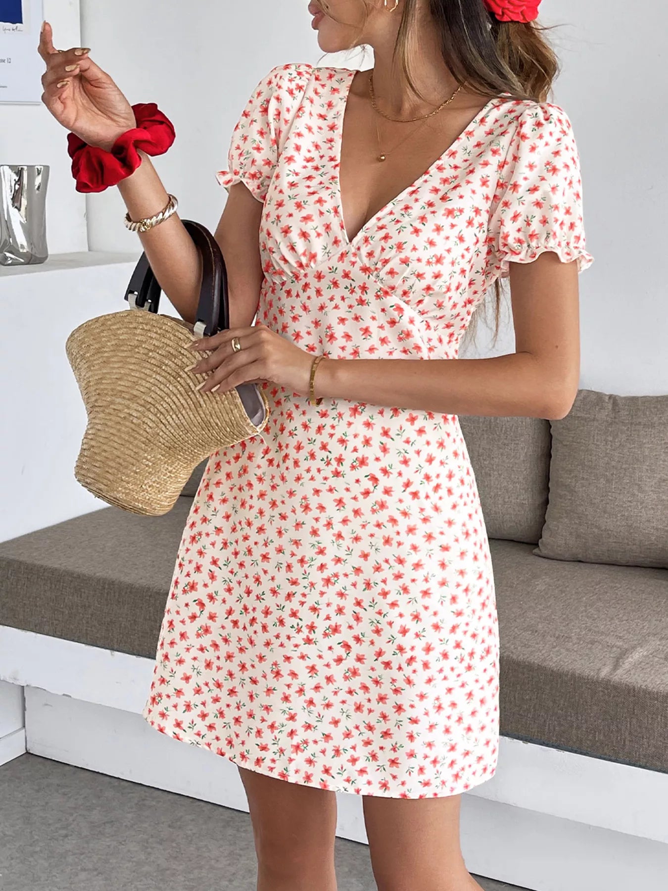 Floral print V-neck puff sleeve mini dress from Trendsi, women's casual summer dress with a flowy silhouette and vibrant floral pattern.