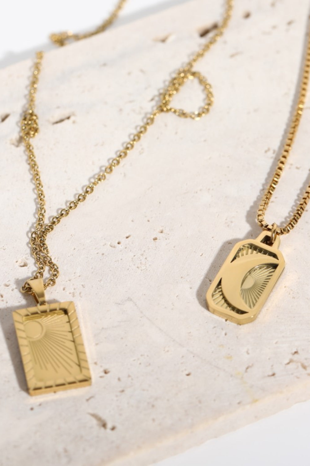 Stainless steel 18K gold-plated necklace with a sleek, polished finish, displayed on a neutral background.