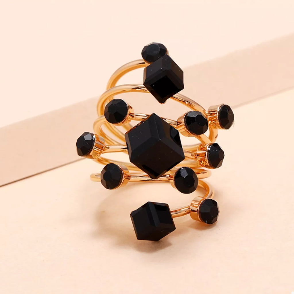Multi-layered 18K gold-plated ring from Shopimist showcasing intricate design and shiny finish on a white background.