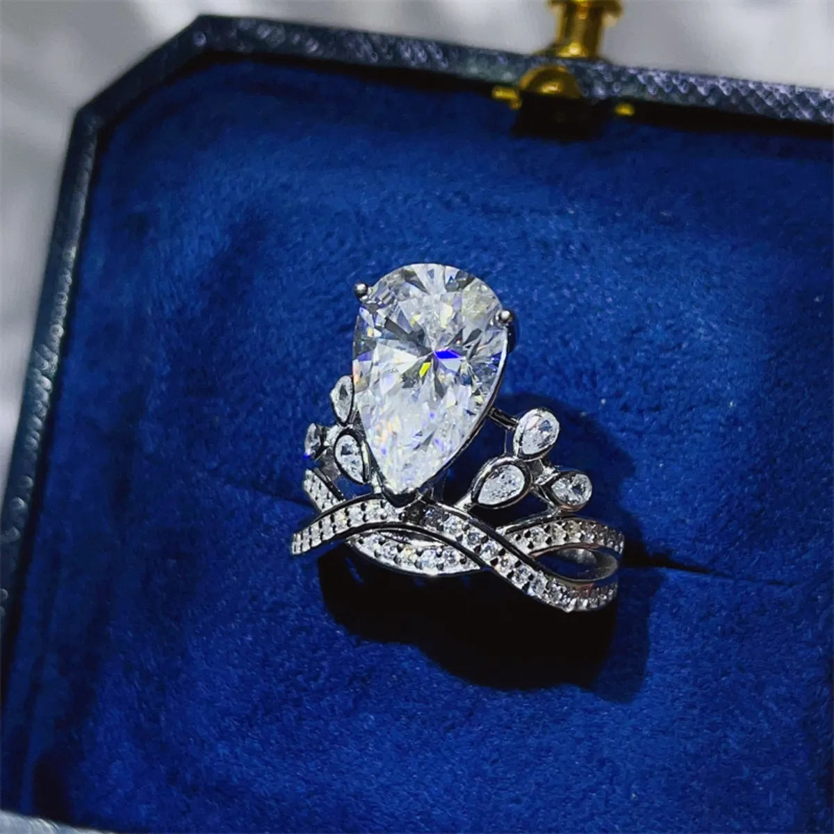 Sterling silver ring with a 5-carat moissanite gemstone, featuring a sleek band and sparkling center stone.