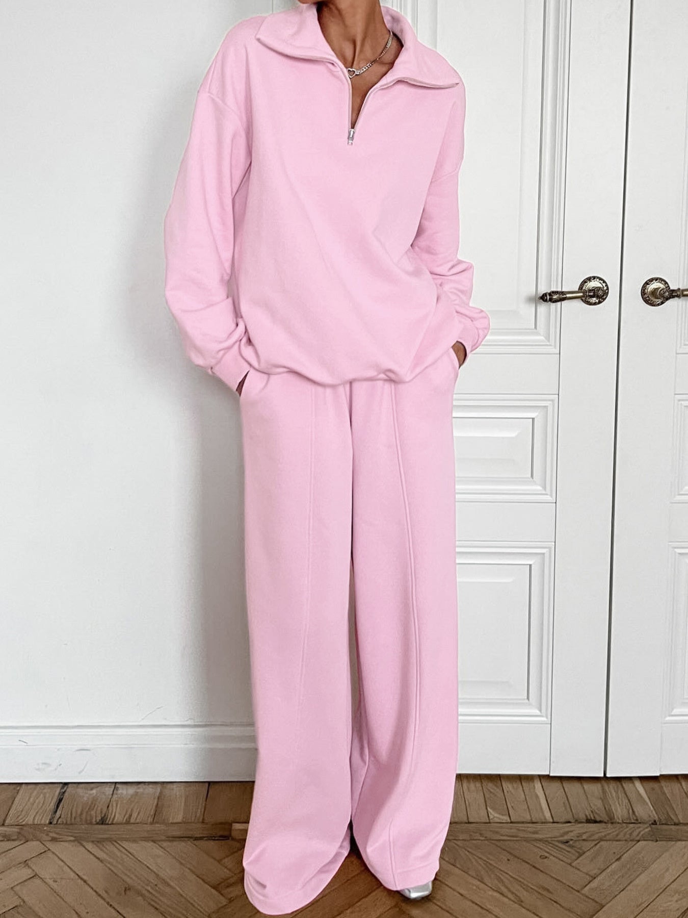 Women's quarter zip long sleeve loungewear set by Trendsi, stylish two-piece tracksuit with a comfortable fit and casual design.