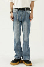 Raw hem denim jeans with pockets by Trendsi, showcasing distressed edges and classic five-pocket design on a casual model.
