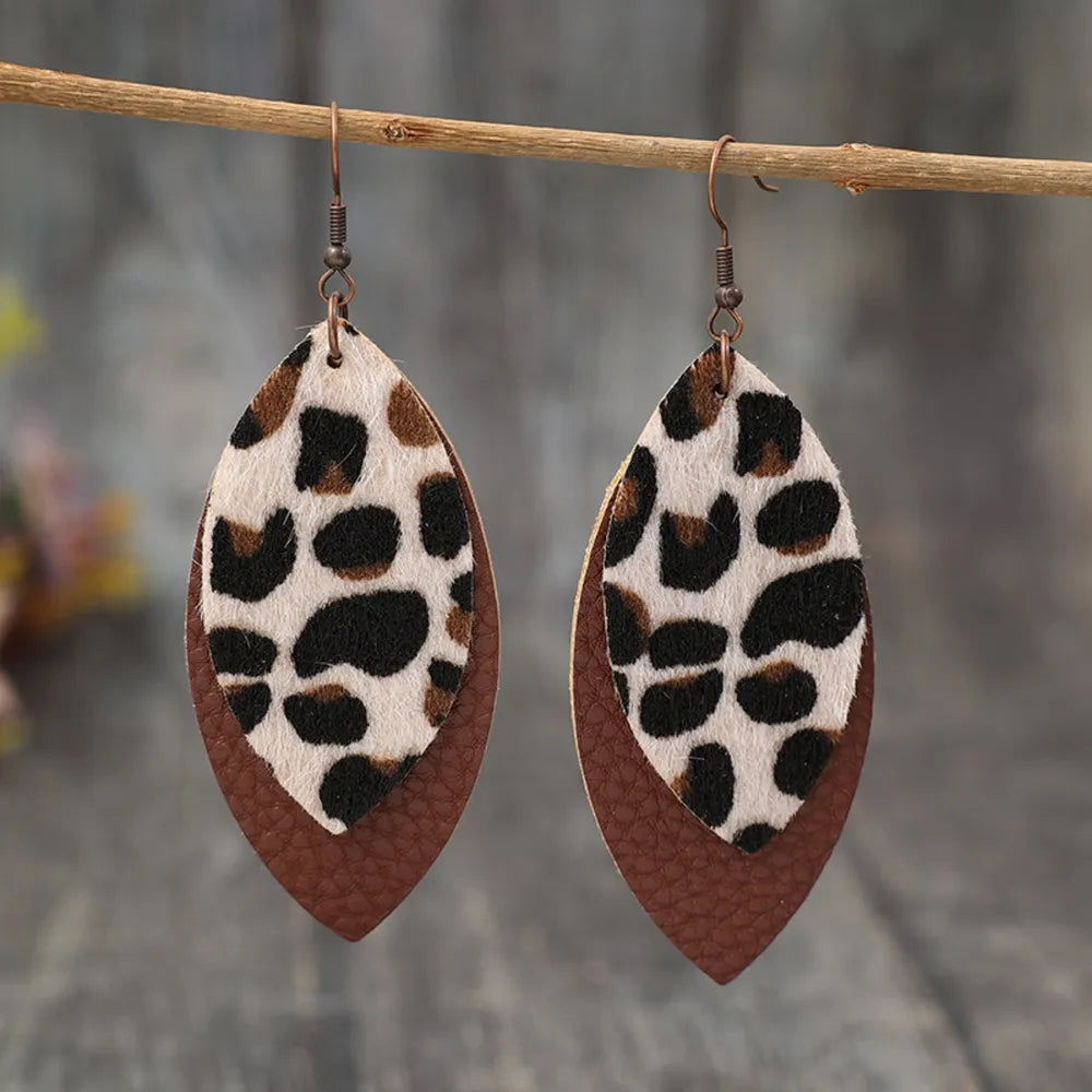 Leaf-shaped leather dangle earrings from Plush Fashion Hub, featuring a stylish natural leaf design for fashionable accessories.
