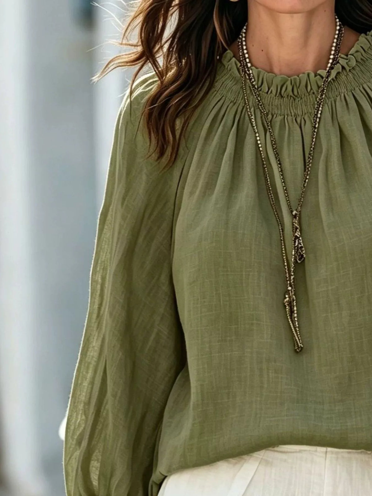 Women’s round neck balloon sleeve blouse by Trendsi, featuring soft fabric and stylish puffed sleeves in a flattering fit.