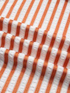 Stripe pinched V-neck mini dress with turn-up cuffs and pockets by Plush Fashion Hub, featuring a stylish striped pattern and fitted silhouette.