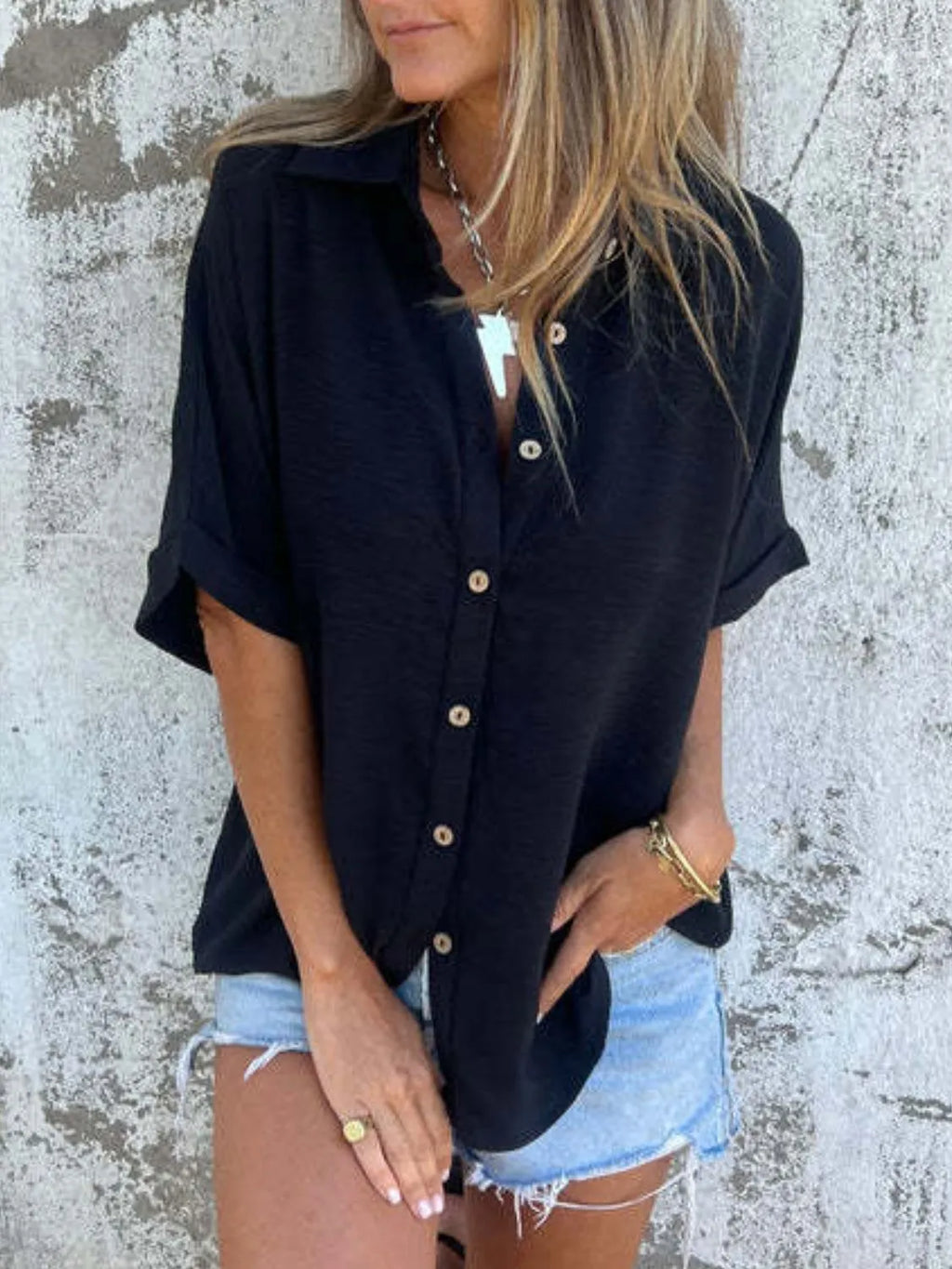 Women's collared half sleeve button-down blouse from Trendsi, perfect for a sophisticated office look.