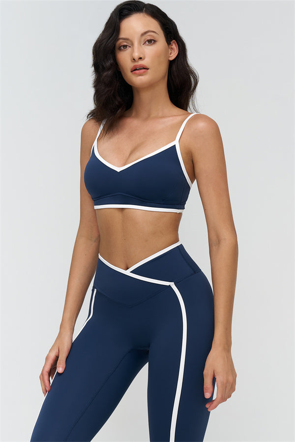 Plush Fashion Hub Crave Contrast Sports Bra and Leggings 2-piece set with black and white design, stretchy fabric, and athletic fit.