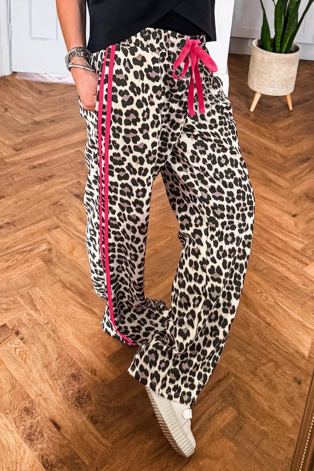 Leopard print casual pants with drawstring waist from Plush Fashion Hub, featuring a regular fit and stylish animal print design.