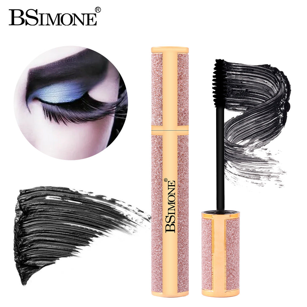 BSIMONE glittery rose gold mascara tube with black wand and black mascara swatches and eye makeup inset.