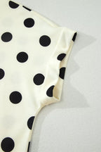 Polka dot print high neck dolman top by Plush Fashion Hub, featuring a stylish relaxed fit and high neckline.