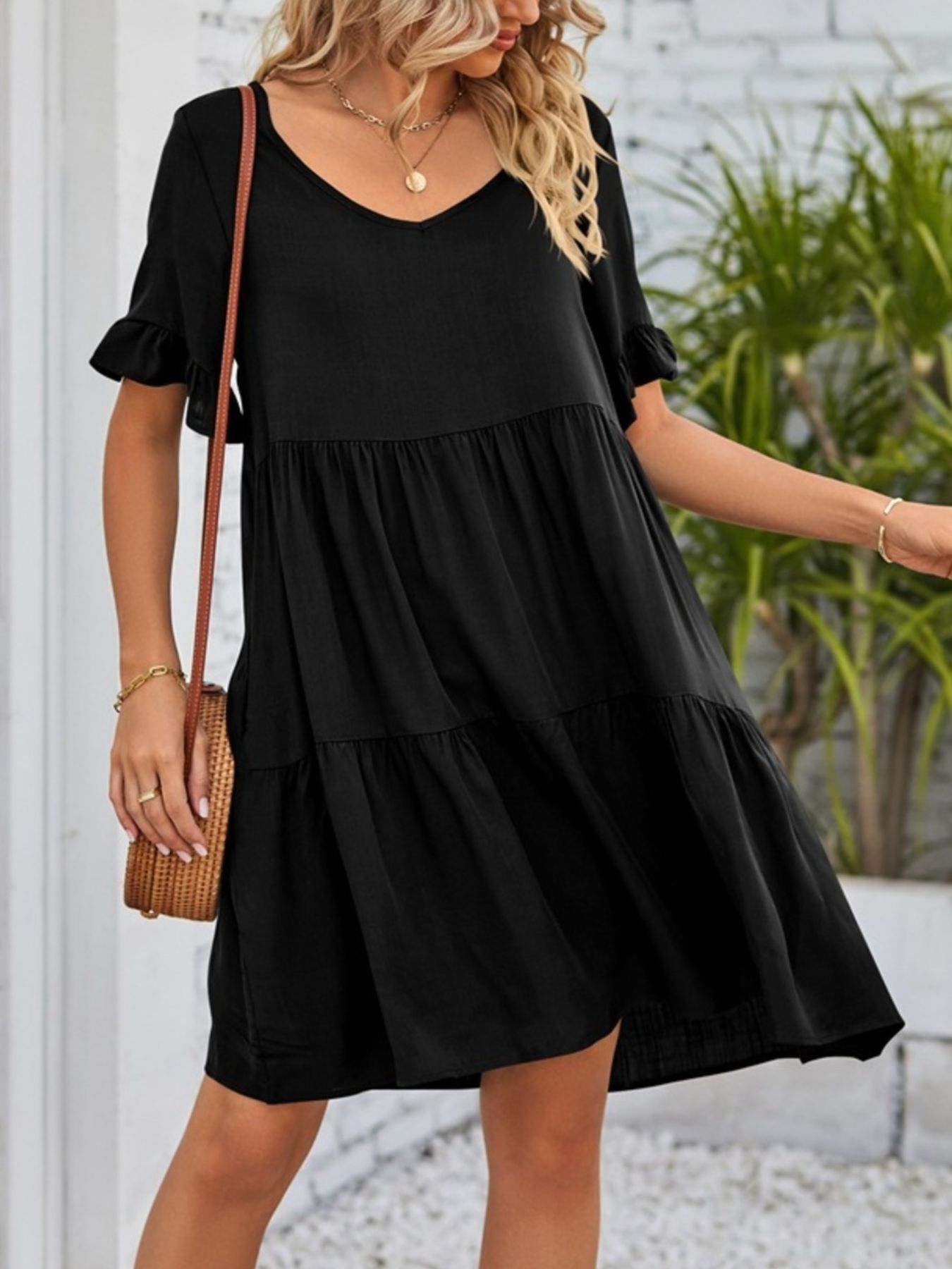 Lightweight rayon ruffled sleeve tiered mini dress with pockets, stylish and comfortable, perfect for casual wear.