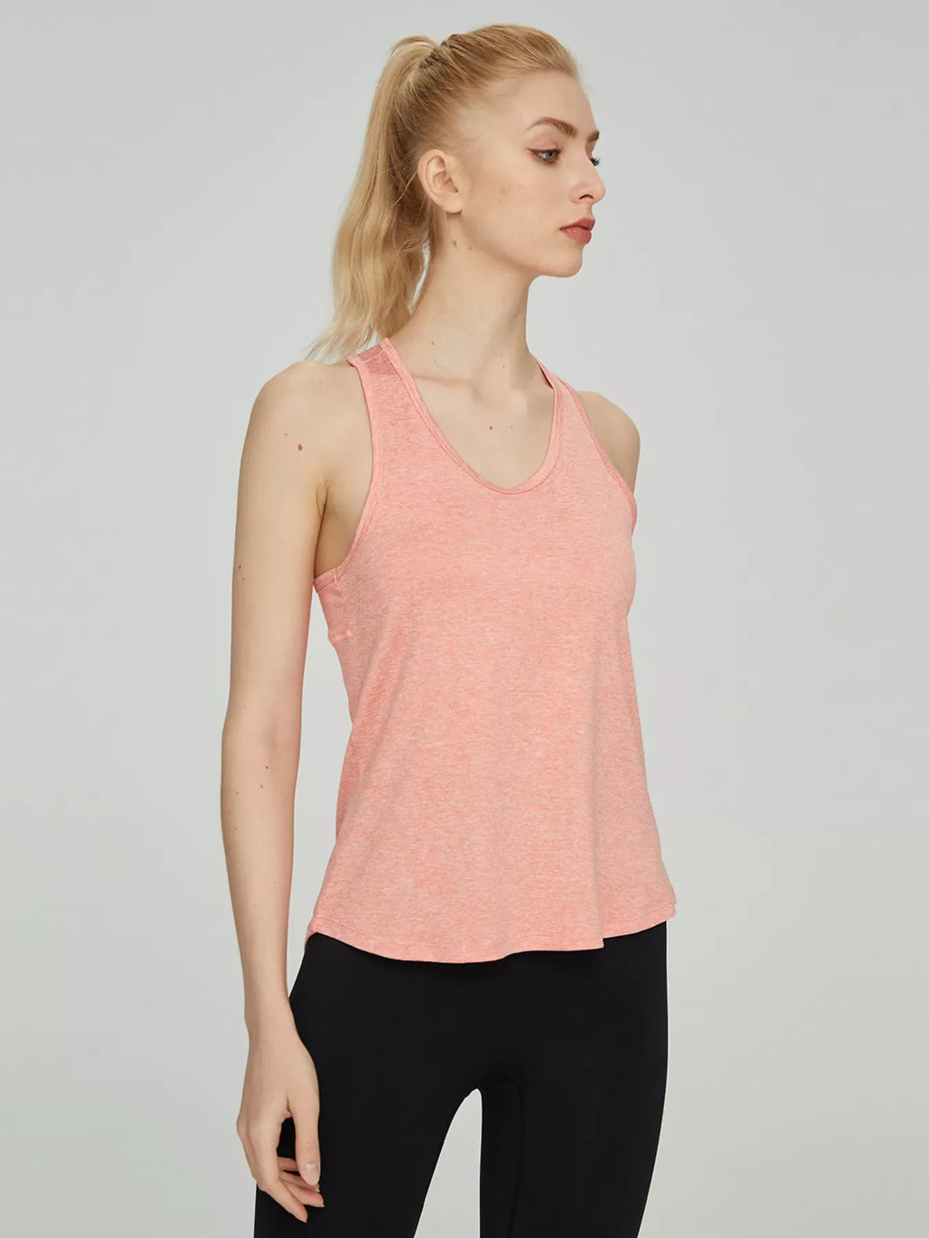 Shopimist breathable quick-drying active tank top, lightweight athletic wear designed for comfort and performance during workouts.