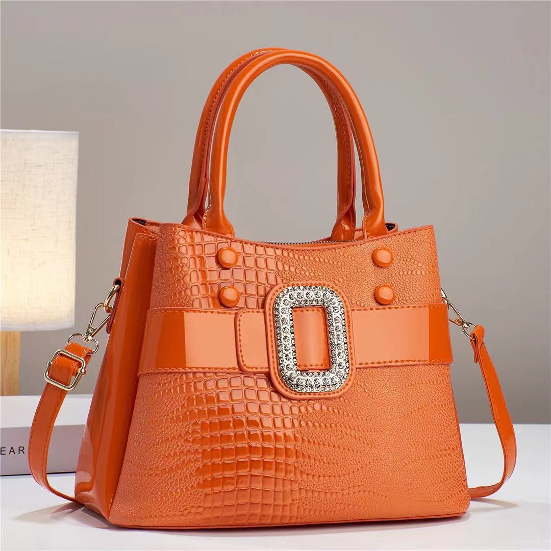 Lizard-patterned mini bucket crossbody bag with zipper from Plush Fashion Hub, featuring a trendy, compact design and adjustable strap.