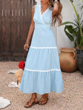 Striped sleeveless tiered midi dress by Trendsi showcasing a flowy, tiered design with bold horizontal stripes.