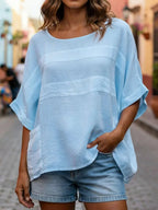 Loose-fitting Plush Fashion Hub crew neck top with three-quarter sleeves, shown in a relaxed, casual style.