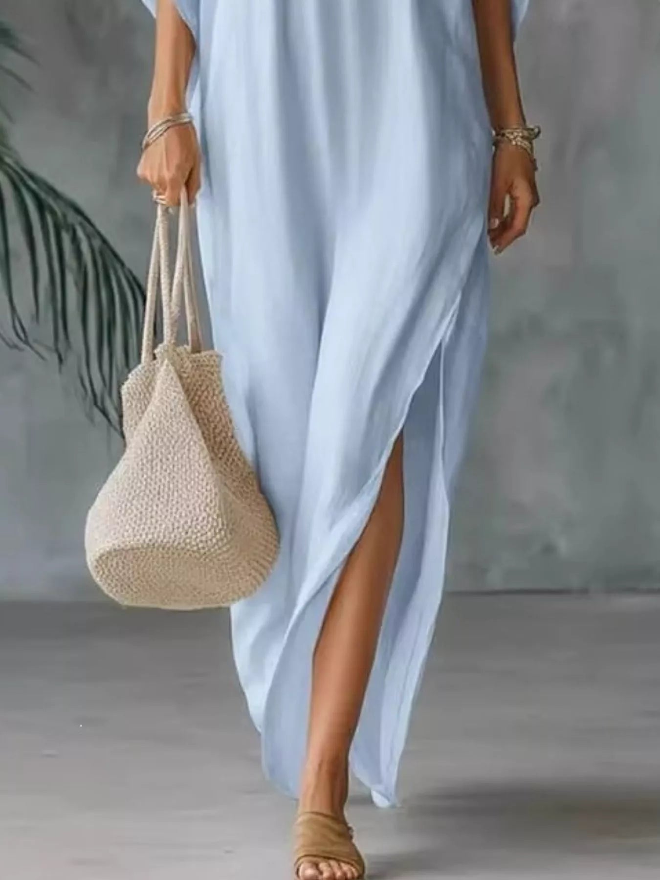 Plush Fashion Hub plus size V-neck maxi dress with side slits, full-length, soft fabric, and comfortable fit.