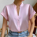Light orange satin V-neck short sleeve shirt for women, casualwear from Plush Fashion Hub, displayed on a neutral background.
