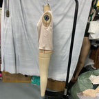 Women's elegant sleeveless mock neck top by FitiqueFit, casualwear style, shown in a neutral color on a plain background.
