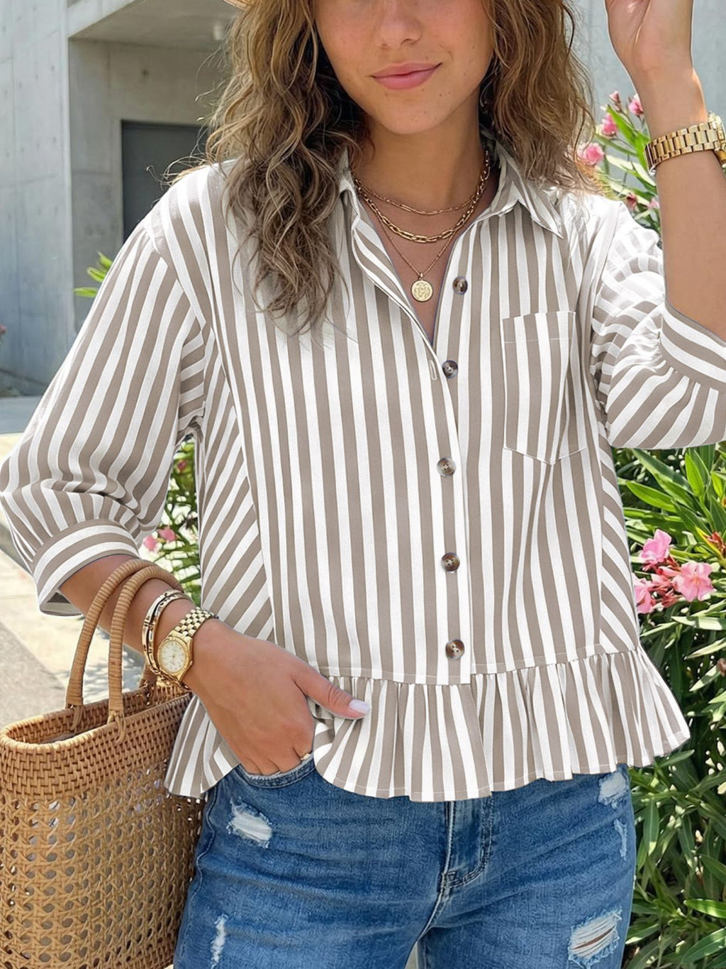 Women's striped button-down blouse with ruffled hem, lightweight viscose fabric, casual style, featuring vertical stripes and a relaxed fit.