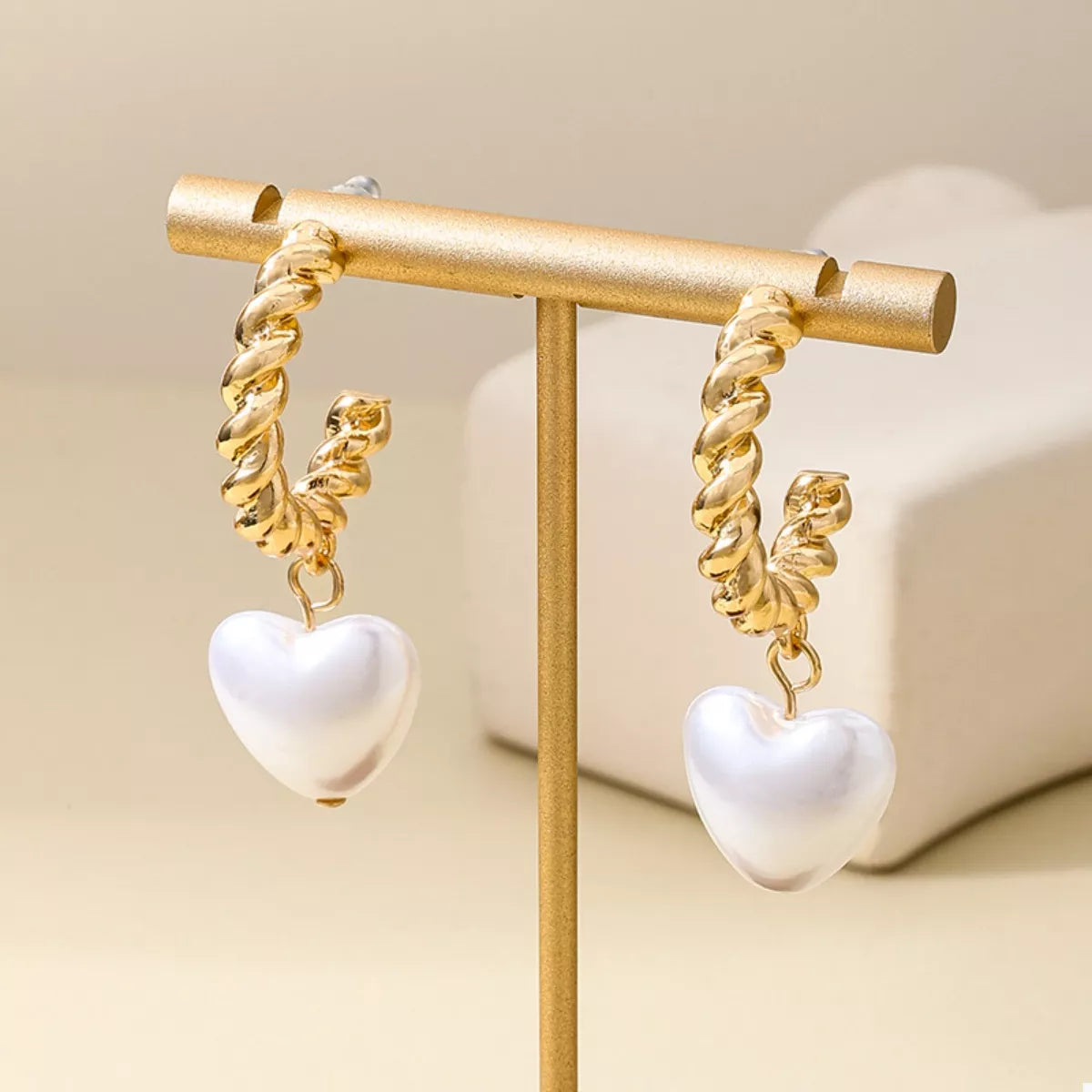 18K gold-plated C-hoop heart earrings by Shopimist featuring delicate heart charms on sleek hoop earrings.