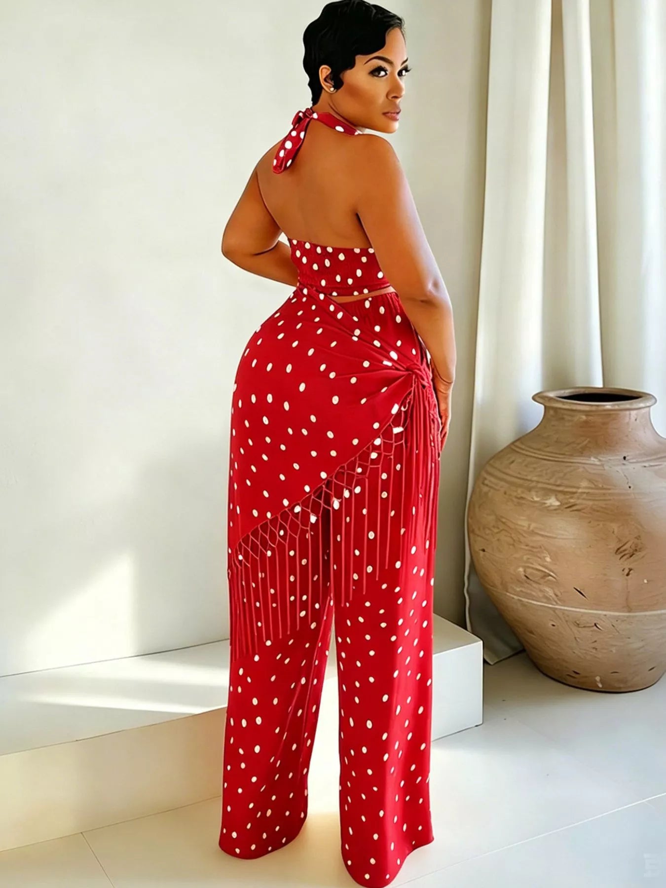 Polka dot halter neck cami and fringe trim pants set by Trendsi, with rings detail, shown in a stylish, coordinated outfit.