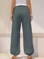 Casual loose fit harem joggers with drawstring waist, Trendsi brand, featuring relaxed style and comfortable fit.