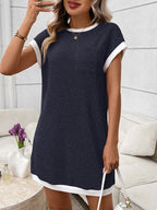 Ribbed knit mini dress with contrast trim and functional pocket, trendy dress by Trendsi featuring a fitted silhouette and stylish details.