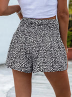 Floral print elastic waist shorts by Trendsi featuring lightweight fabric and vibrant floral design, perfect for casual summer wear.