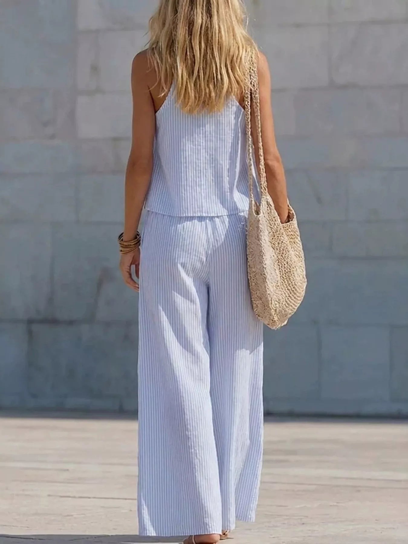 Striped V-neck tank top and wide-leg pants set by Plush Fashion Hub, casual two-piece outfit with bold stripe pattern.