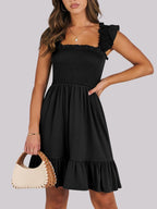 Women's lightweight smocked ruffle hem mini dress by Trendsi, casual summer dress with breezy design and ruffle details.