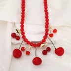 Cherry charm beaded statement necklace by Shopimist featuring vibrant red cherry beads and elegant design.