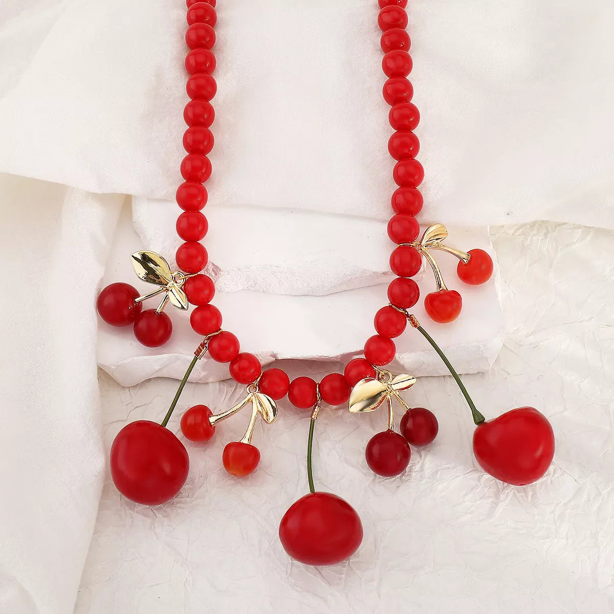 Cherry charm beaded statement necklace by Shopimist featuring vibrant red cherry beads and elegant design.