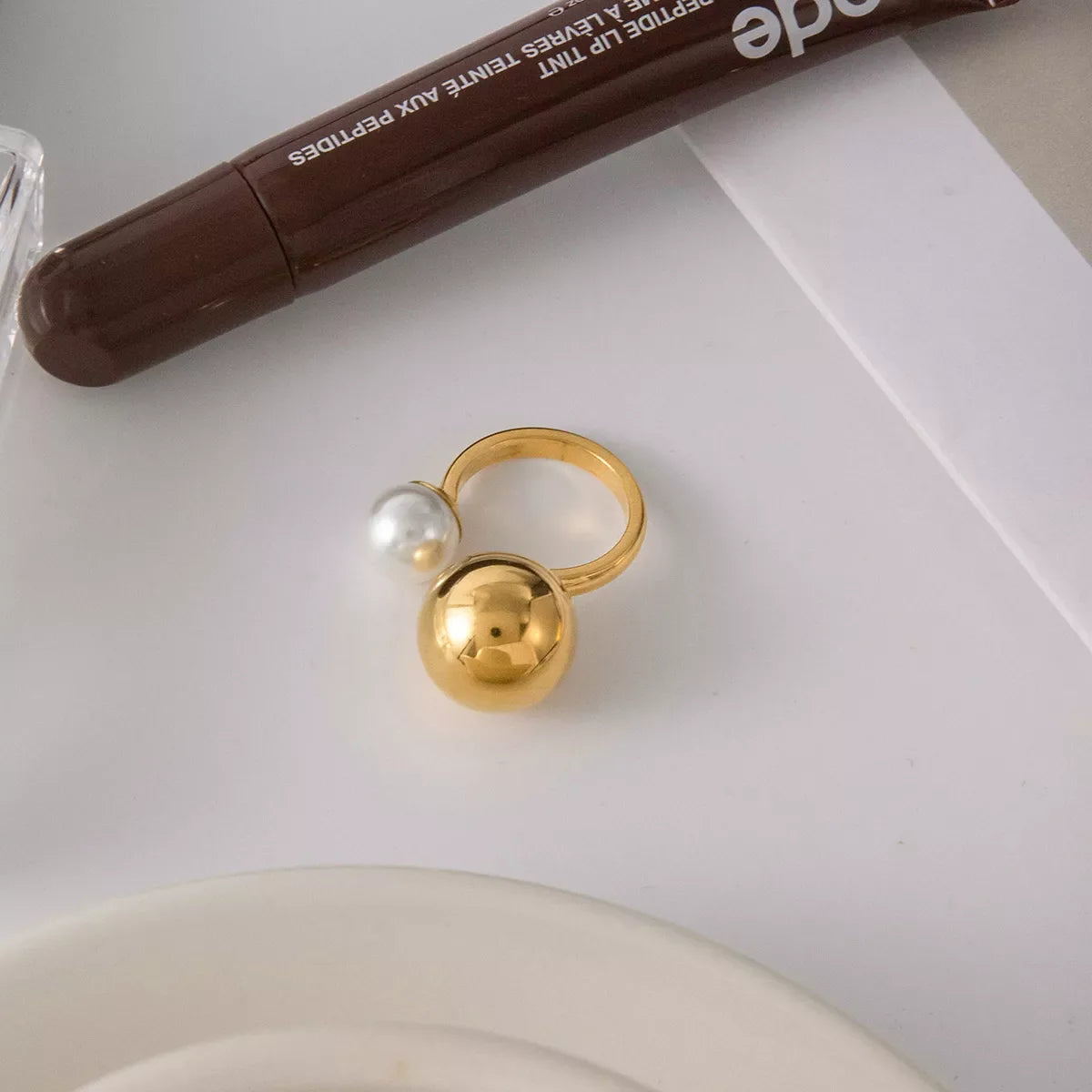 18K gold-plated open ring featuring a pearl and orbit design, showcasing a stylish jewelry piece.