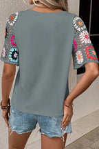Plush Fashion Hub geometric print round neck short sleeve blouse, stylish tops with modern design, displayed on a neutral background.