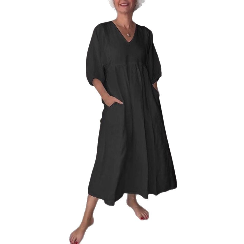 Deep V-neck pleated solid color pocket dress by eprolo featuring a flattering V-neckline, pleats, and side pockets.