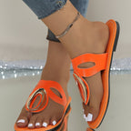Women's open toe low heel sandals by Trendsi featuring golden accent details and stylish design.