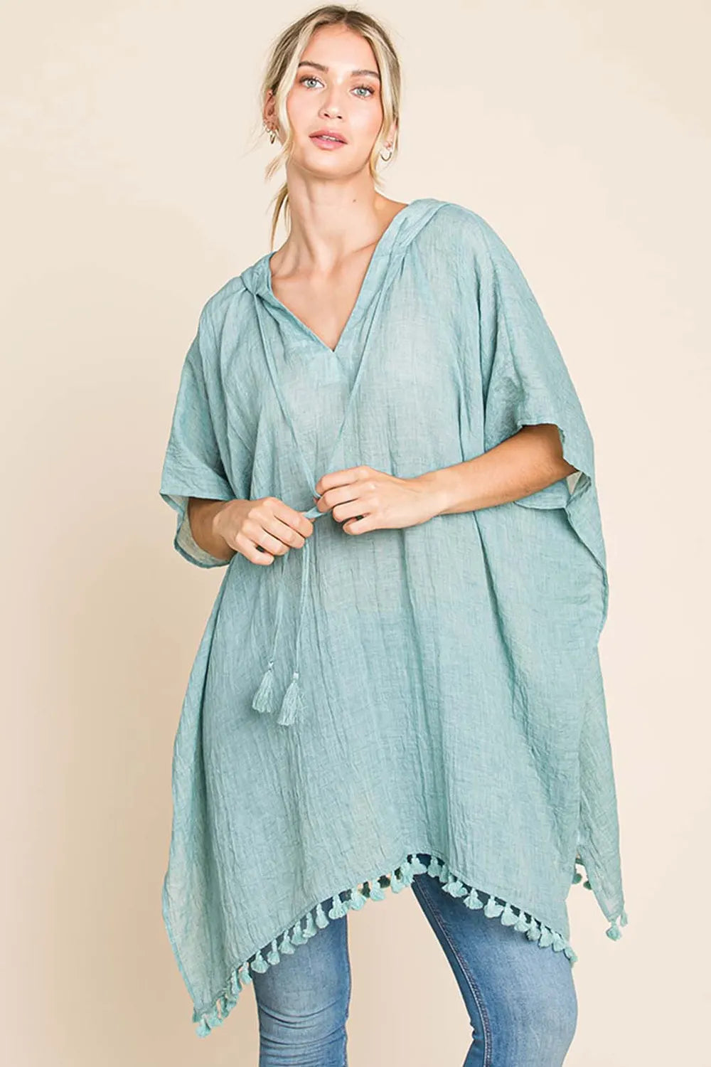Women's cotton hooded beach cover-up dress with tassel hem, lightweight and breezy for summer beachwear.