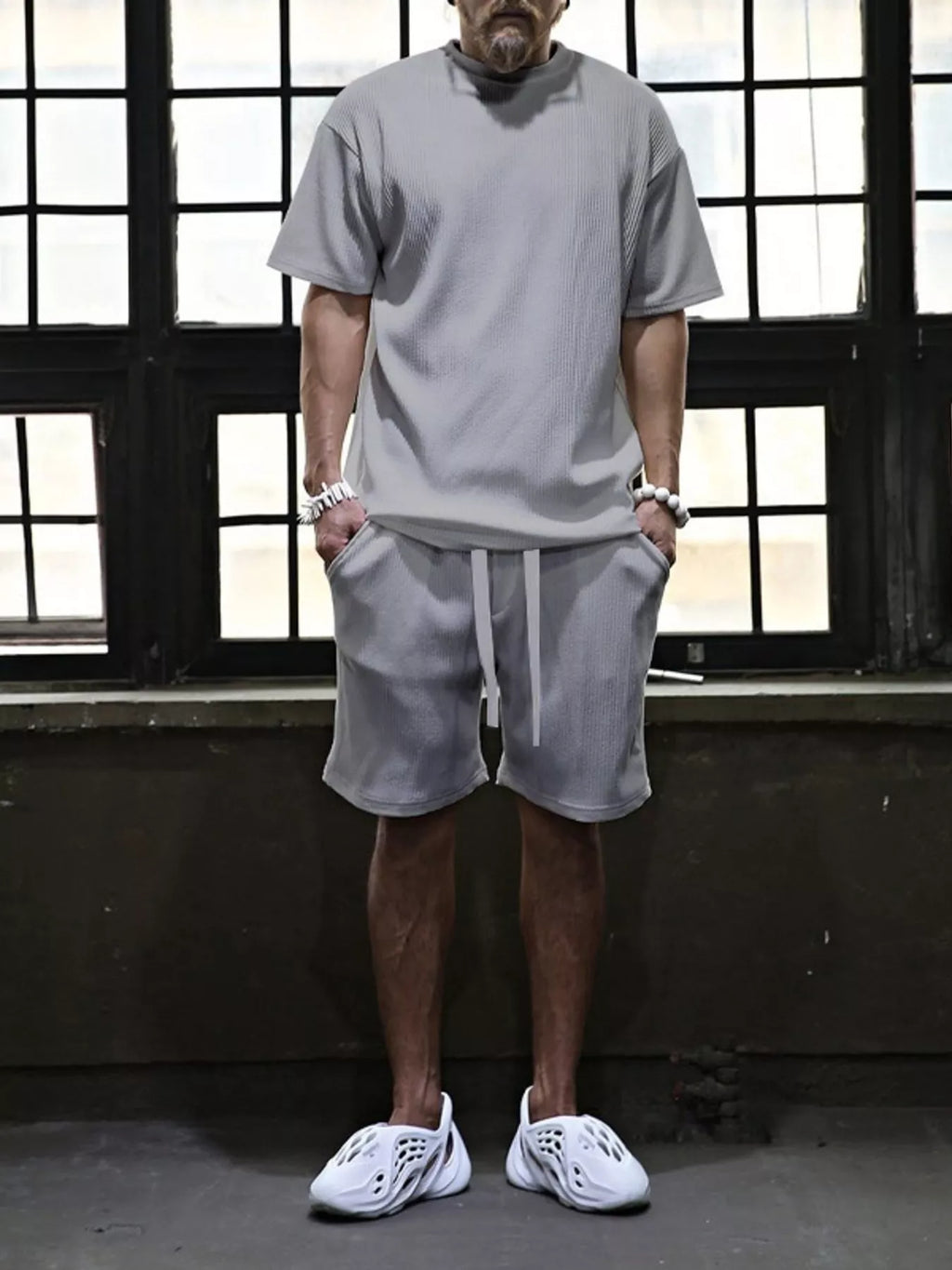 Men's plus size short sleeve top and shorts set from Trendsi, casual summer clothing, black color, front view.