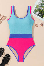Threaded Pear Rory patchwork one-piece swimsuit with colorful fabric panels on a model.