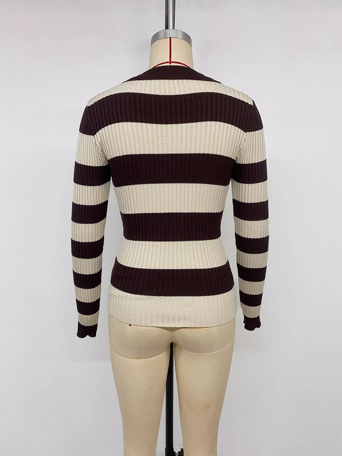 Striped ribbed knit long sleeve sweater shirt by Plush Fashion Hub, featuring a fitted design and classic stripe pattern.