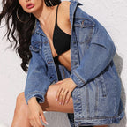 VYSN long sleeve denim jacket displayed on a hanger, featuring classic blue denim with button-front closure and chest pockets.
