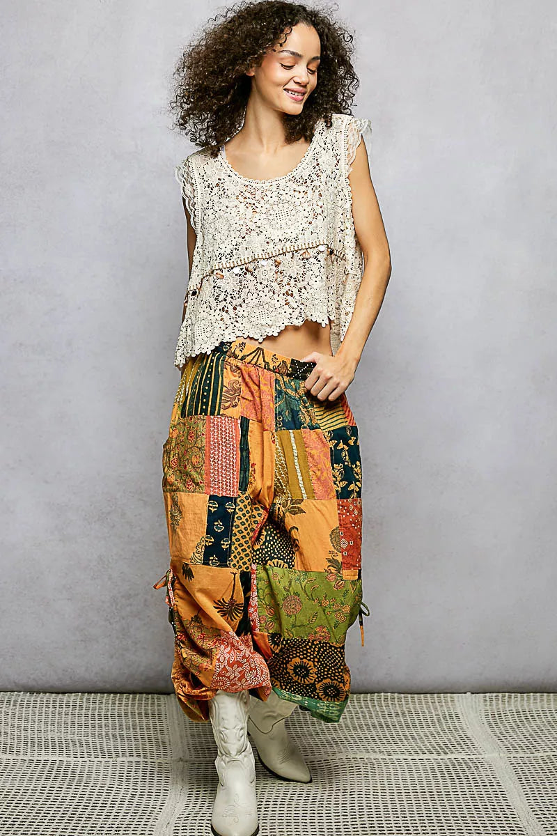 Printed patchwork wide leg cotton pants with side drawstring, casual dress style, colorful fabric, and relaxed fit.