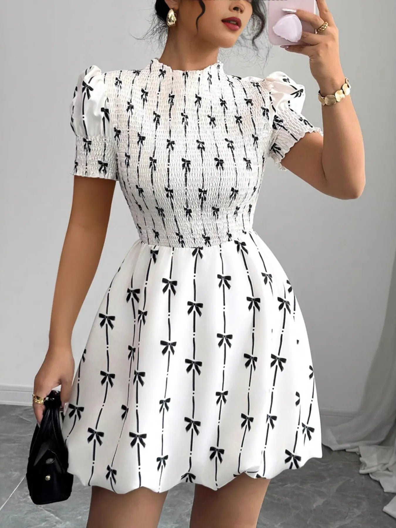 Short sleeve smocked bow print dress by Plush Fashion Hub featuring a fitted bodice and playful bow accents.