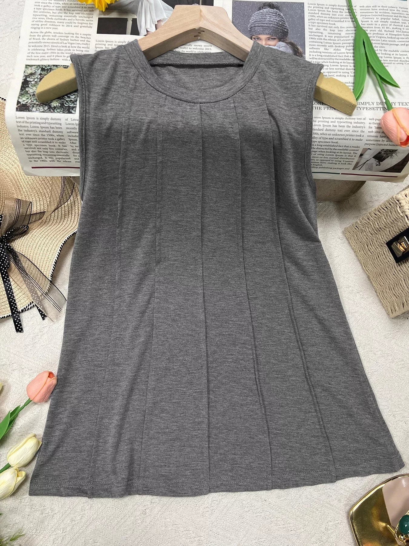 White round neck tank top from Trendsi featuring a sleeveless design and soft, breathable fabric.