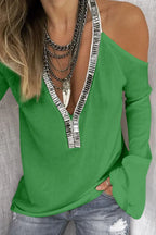 Sequin V-neck cold shoulder top from Trendsi, featuring shiny sequins, V-neckline, and stylish cold shoulder cut-outs.