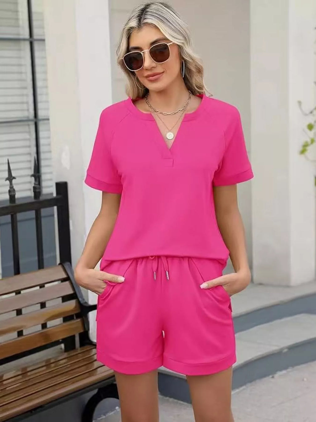 Solid color short sleeve top and shorts two-piece set by Trendsi, casual summer outfit, lightweight fabric, comfortable fit.