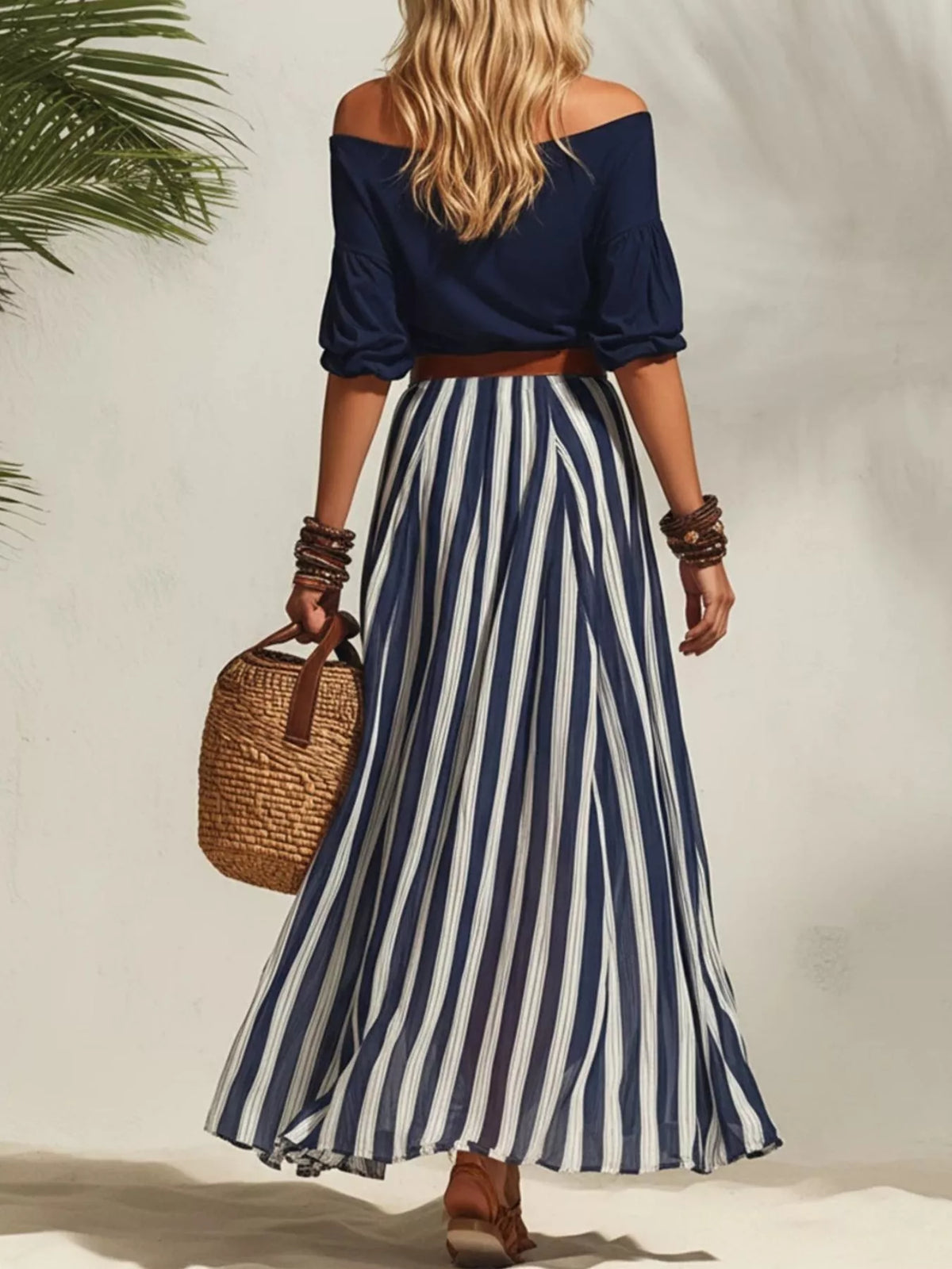 Off shoulder top and striped maxi skirt set by Plush Fashion Hub, featuring a stylish matching outfit with a flowy design.
