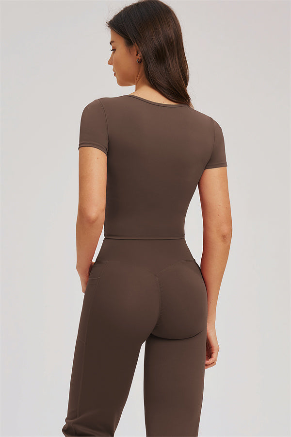 Fitglutes Activewear Sizzle T-shirt and flared leggings 2-piece gymwear set on a model, showcasing stylish workout clothes.