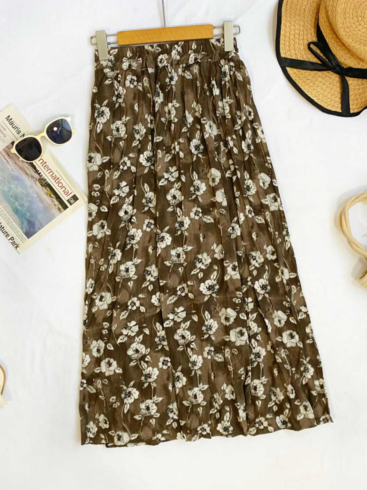 Floral print elastic waist midi skirt from Plush Fashion Hub, showcasing a flowy design with vibrant floral patterns.